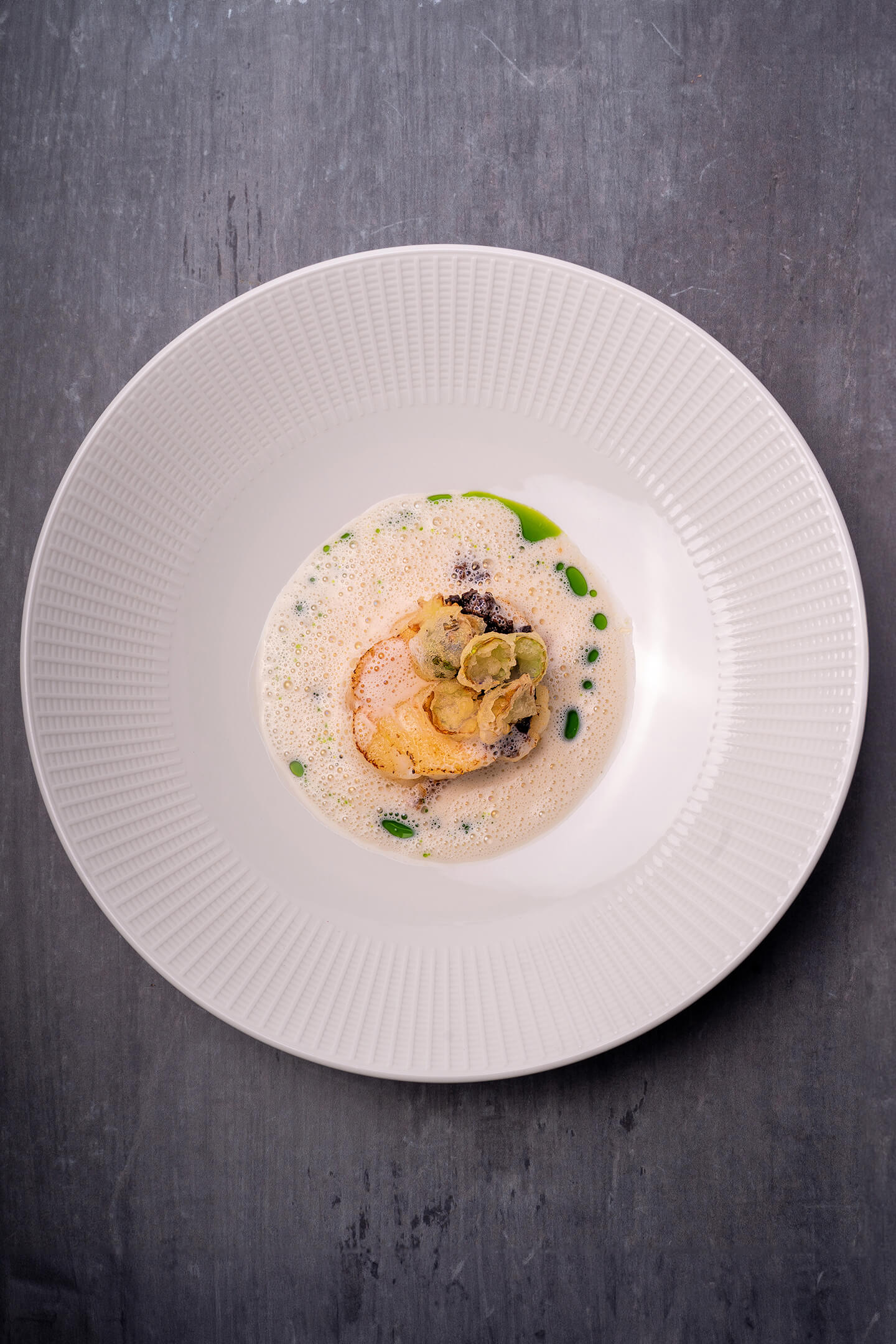 Cod rouleau with hazelnut, purple carrot XO, Brussels sprout leaf and ramson